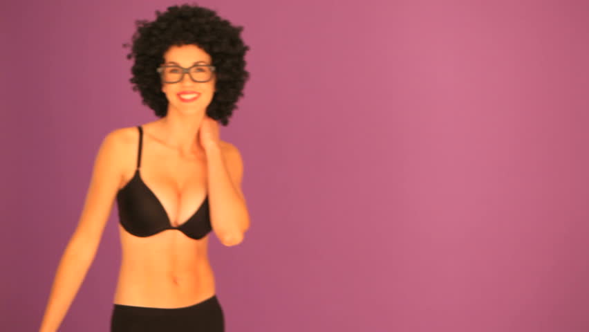 Woman with black afro hairdo waving
