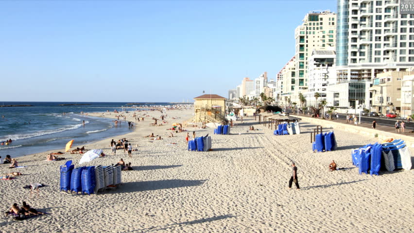 Tel-Aviv â September 26: people and recliners at the beach in stop motion in Tel-Av