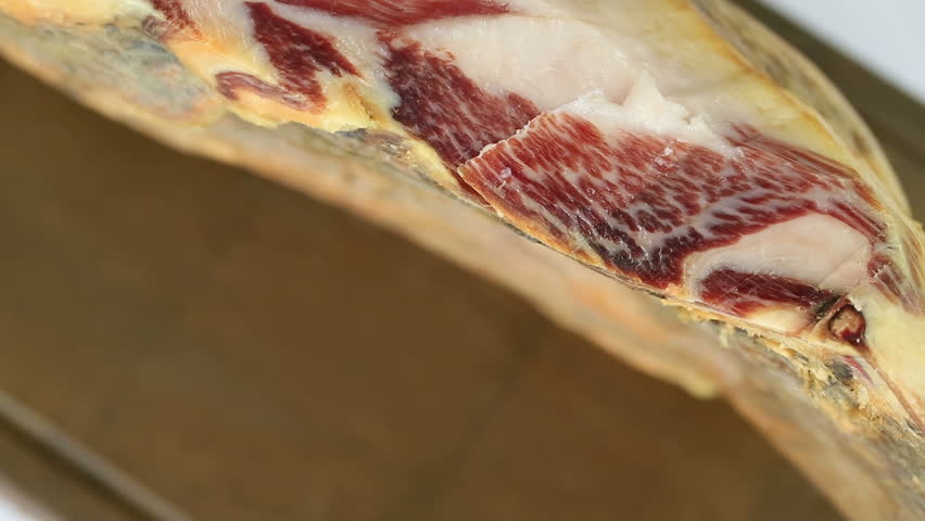 Cutting serrano ham slices