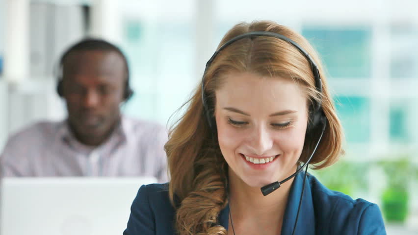 Cheerful customer support representative consulting the client with enthusiasm