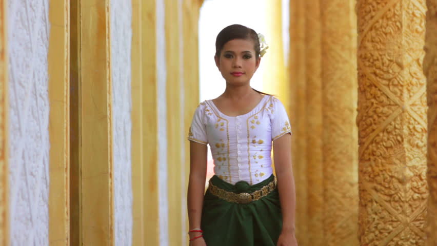 Beautiful Asian Girl performs Cambodian folk dance in temple