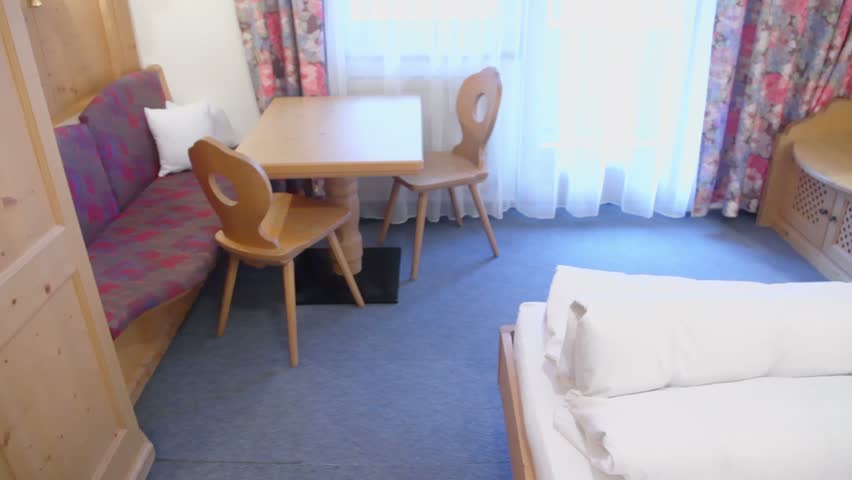 Hotel room with beds and other furniture, panoramic motion