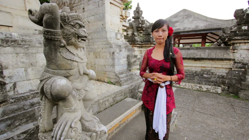 Balinese girl saluting with both hand in Bali