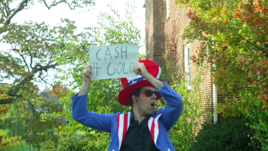 Gold exchange guy with a sign