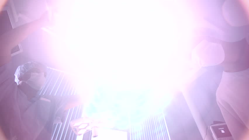 surgeon turns on light in hospital room 