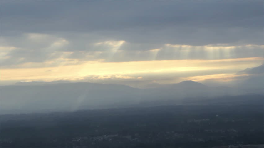 Aerial view of sun rays on cloudy early morning