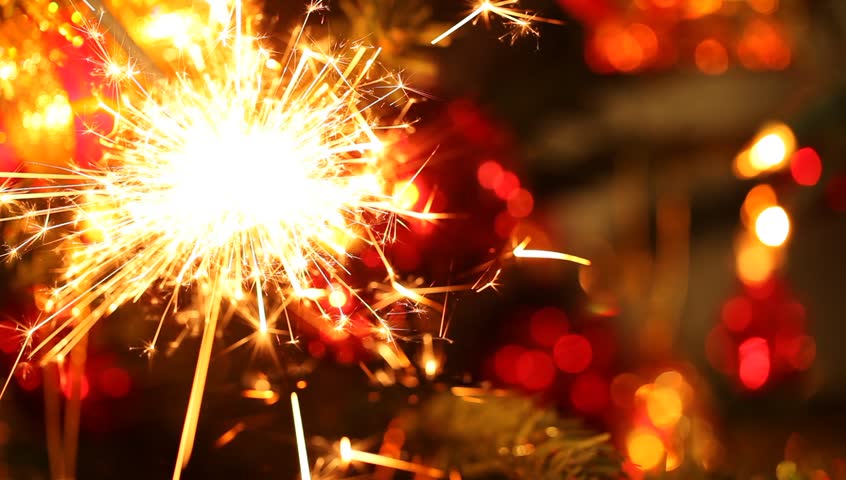 Close-up view of lit up holiday sparkler