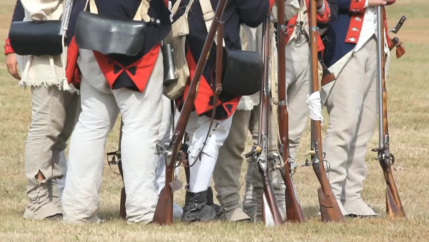 Revolutionary War Era Soldiers Standing Around While Others Pass Behind Come To Attention