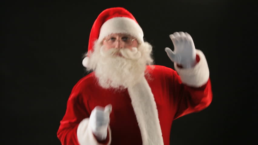 Cheerful Santa Claus dancing against black background