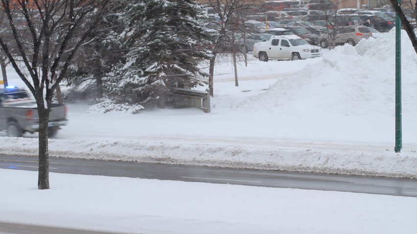 Snow blower in winter on the road