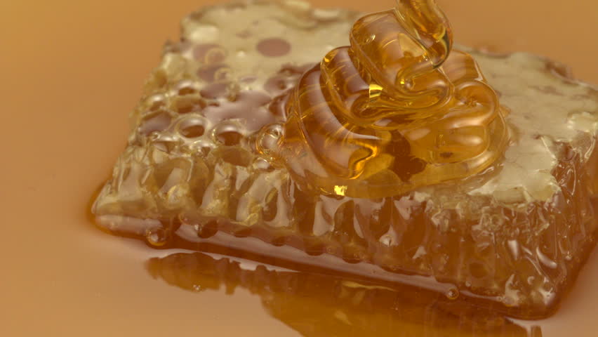 Honey pouring on honey shooting with high speed camera.