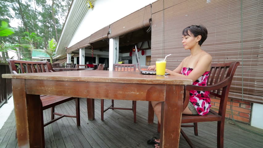 Freelance business woman working at cafe on a laptop in the day