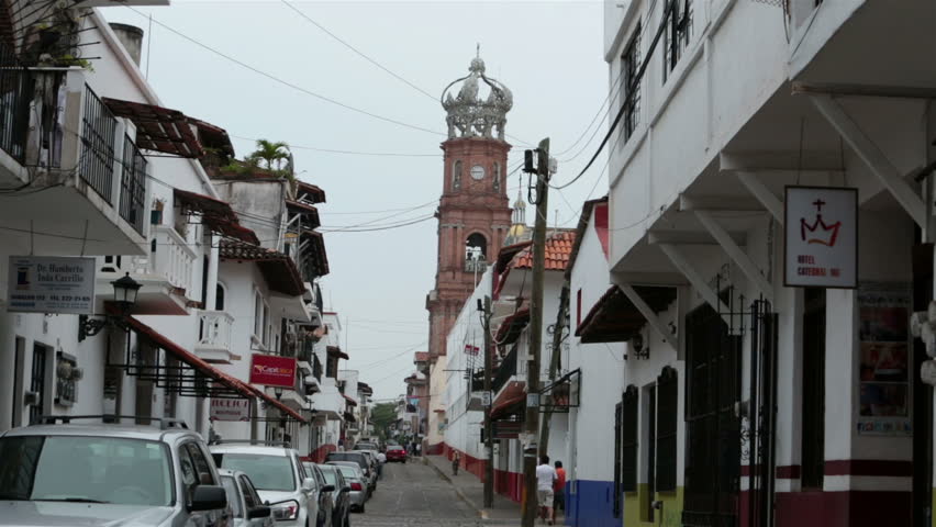 PUERTO VALLARTA, MEXICO - CIRCA NOV 2012: Puerto Vallarta Cathedral of Our Lady of Guadalupe road circa November 2012 in Puerto Vallarta, Mexico. Historic church in middle of congested old business area of town.