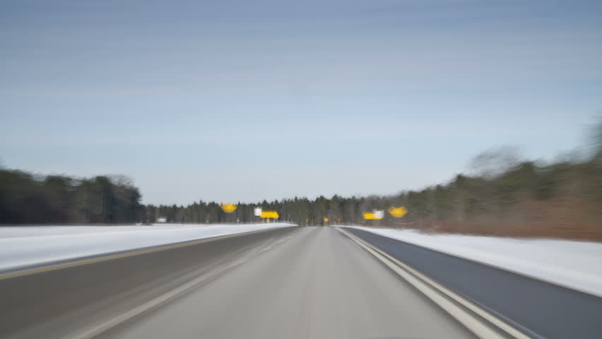  timelapse drive following a red car on secondary rural roadway in winter