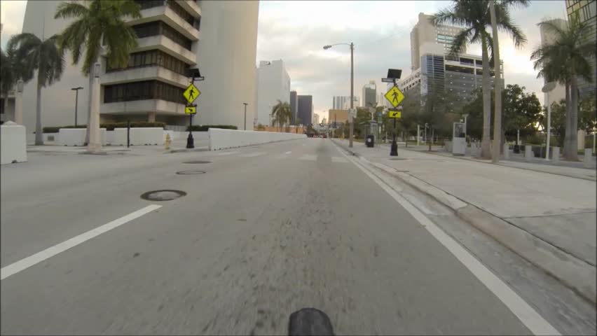 MIAMI BEACH, FLORIDA - NOVEMBER 23: Bicycle POV, driving along NE 4 Street in between the Miami Courthouse and the Federal Detention Center, November 25, 2012 in Miami, Fl.