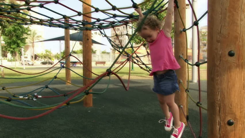 Girl playing at playground in the daytime