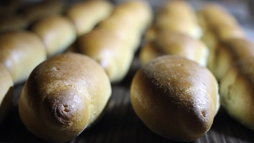 Baked loaf of bread in the bakery, just out of the oven with a nice golden color