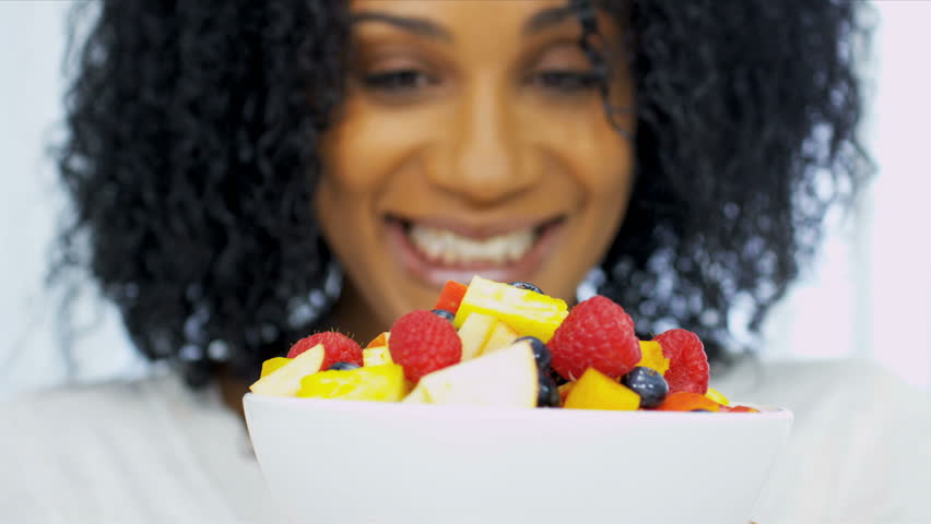 Pretty Ethnic Girl Eating Fresh Fruit Salad