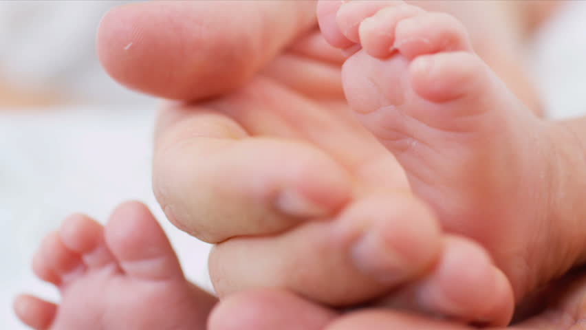 Babies feet proud parent