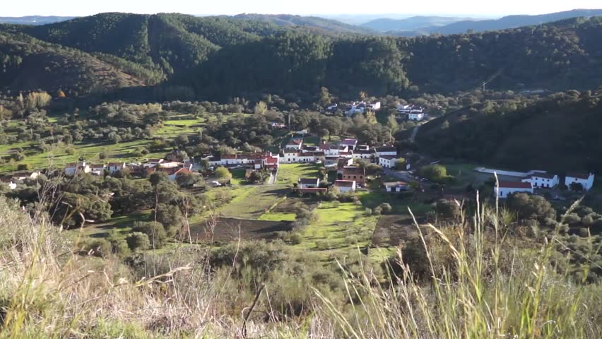 Andalusian village. Tranquil Andalusian white village with mountains, trees, in the background 