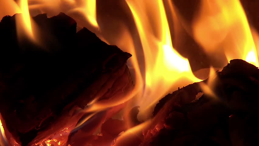 Fire with ember burning in furnace slow motion
