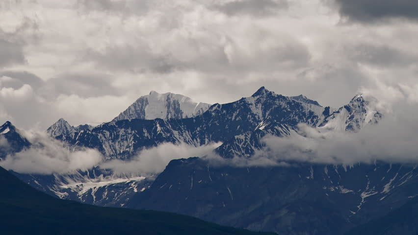 Time lapse of wickedly intense clouds roiling and flowing over peaks of the Chugach Mountain Range near Matanuska Glacier east of Palmer, Alaska.
