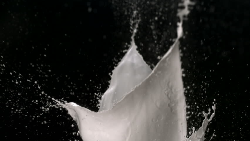 White paint splash in the air shooting with high speed camera.