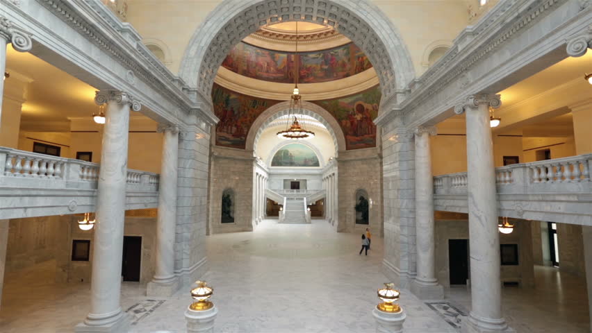 Utah State Capital couple rotunda. Utah State capital building high on a hill overlooking the city of Salt Lake City. Elegant architectural interior design made from marble and copper outer dome.