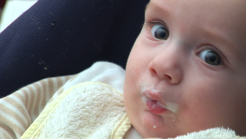Five months old baby chewing his fingers 
