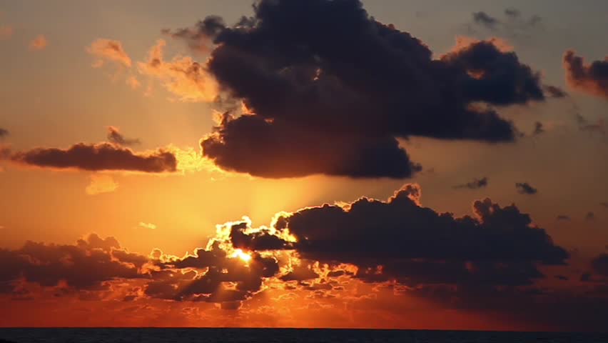 Beautiful time lapse sunrise through the clouds 