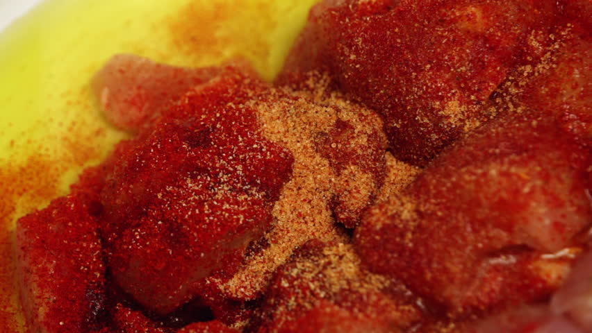 Seasoning chicken meat with spices