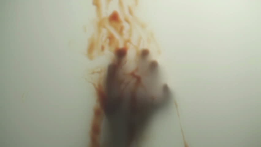 Blood-smeared hand - probably of a crime victim - behind frosted glass