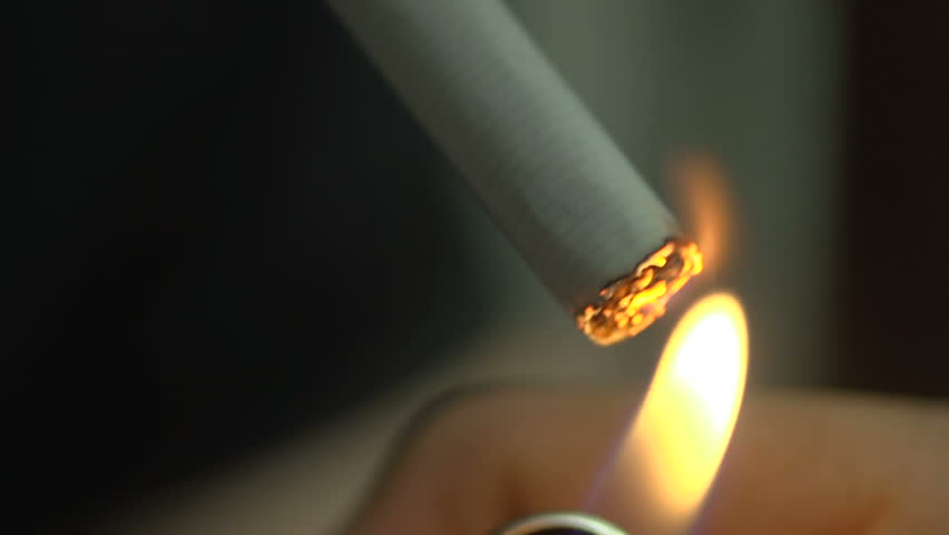 SUPER 35MM CAMERA - Macro of a man smoking a cigarette 