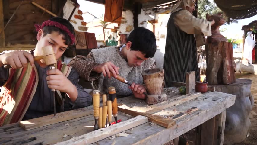 CORRALES, HUELVA, SPAIN - DECEMBER 23: The Living Crib, celebrations,child and man at work acting at reenactment of the Living Nativity, on December 23, 2012 in Corrales, Spain 