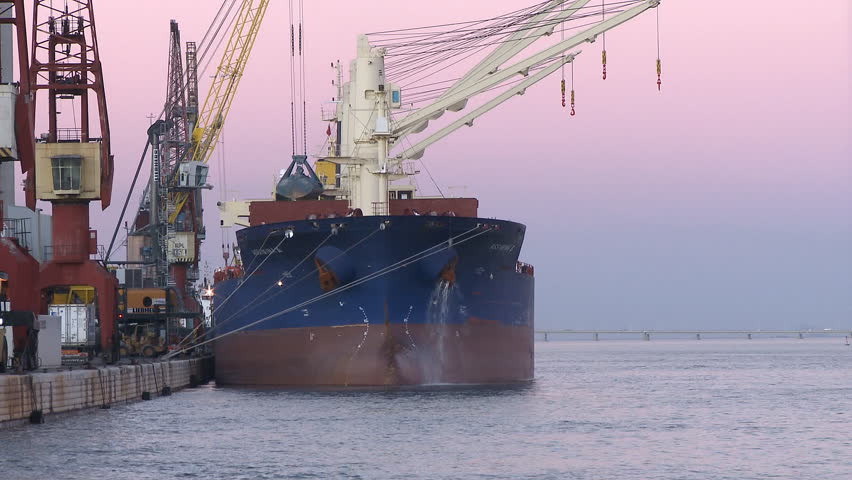 Cargo ship moving load at port Time lapse  