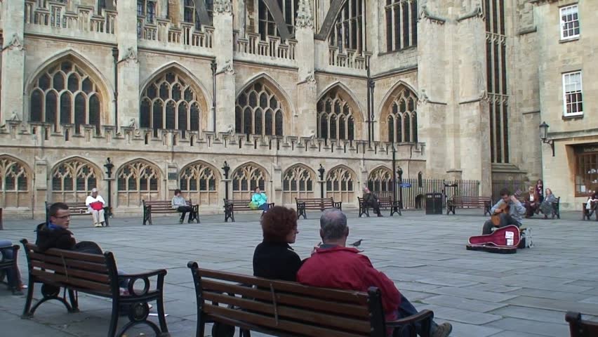 BATH, SOMERSET, UNITED KINGDOM - CIRCA 2011: Tilt up on Bath Cathedral from pedestrianized square.