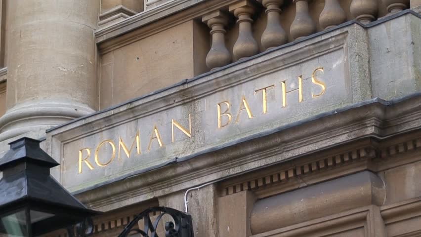 BATH, SOMERSET, UNITED KINGDOM - CIRCA 2011: A group of young people enter the Roman Baths in Bath, Somerset.