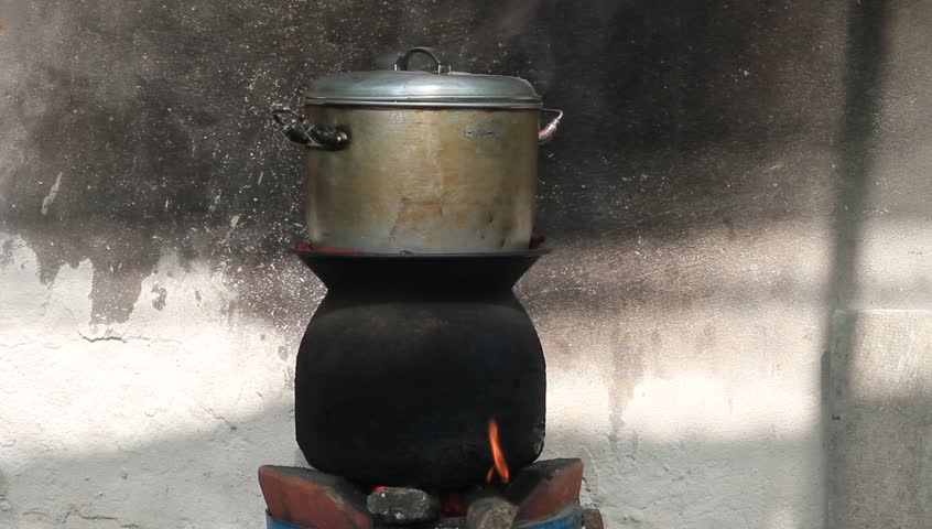 pot on fire old stove, used steam for cooking.