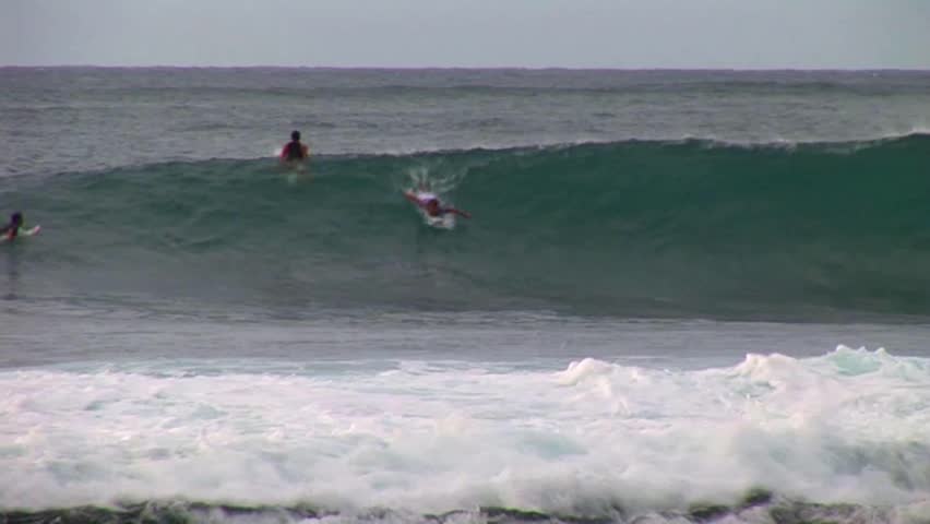 Surfer rips wave.