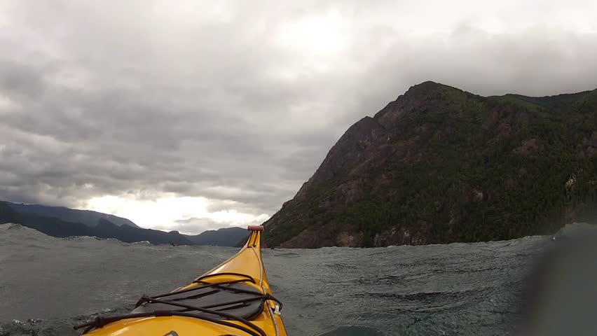 Kayak between big waves and wind.