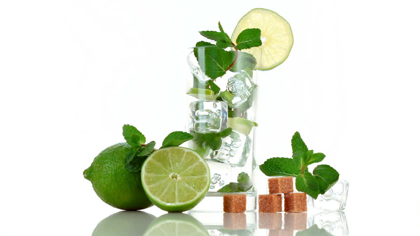 Pouring soda in mojito. Glass, lime, sugar, ice and mint