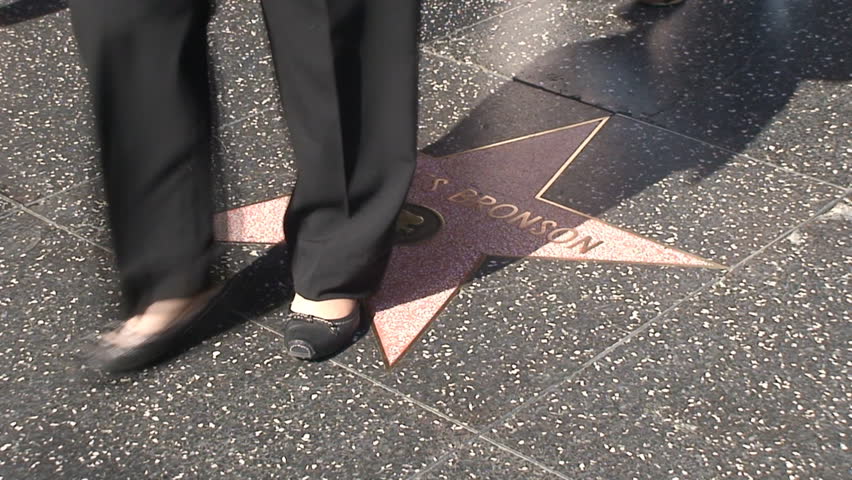 HOLLYWOOD, LOS ANGELES - CIRCA 2009: Tourists walking on Hollywood Walk of Fame in Hollywood, California. 