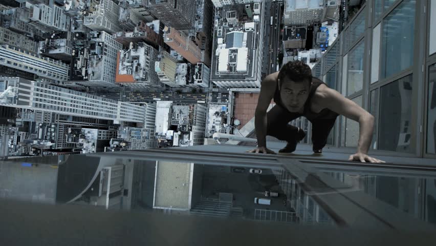 man climbs skyscraper. city superhero. surreal powerful illusion.