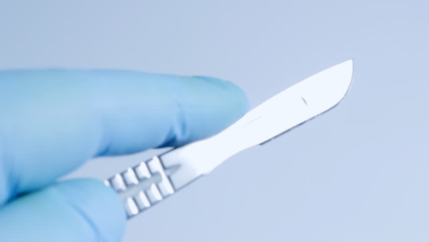 Surgeon with scalpel