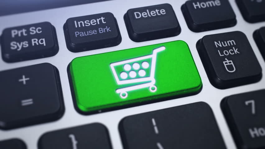Online Shopping. Tracking shot of the computer keyboard key Shopping Cart.