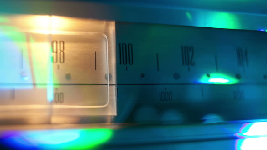 a glowing radio with the marker running through the different stations and frequencies