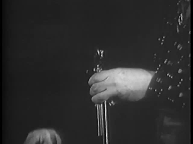 Close-up of man loading handgun