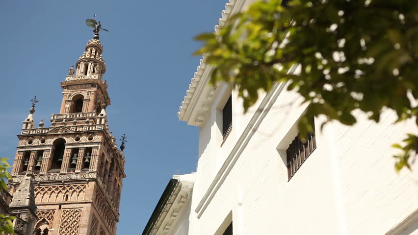 View of the famous Seville mosche with its Giralda minaret in a typical day
