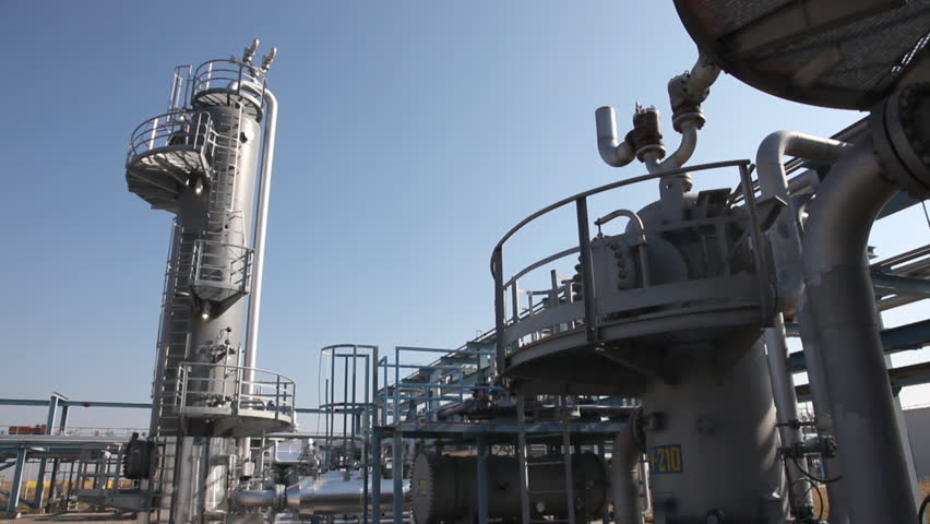 Underground storage of natural gas. Factory distribution, and industrial processing of natural gas with Worker. Many pipelines and construction. 