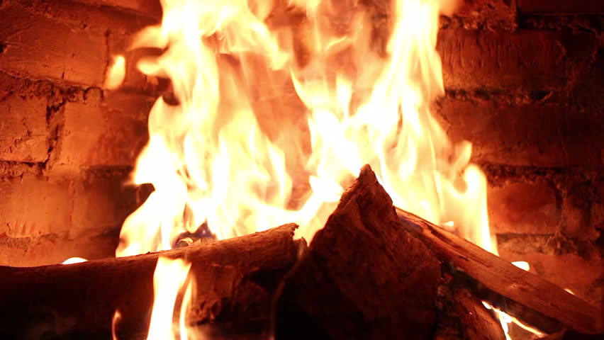 Hot fireplace full of fire wood and fire